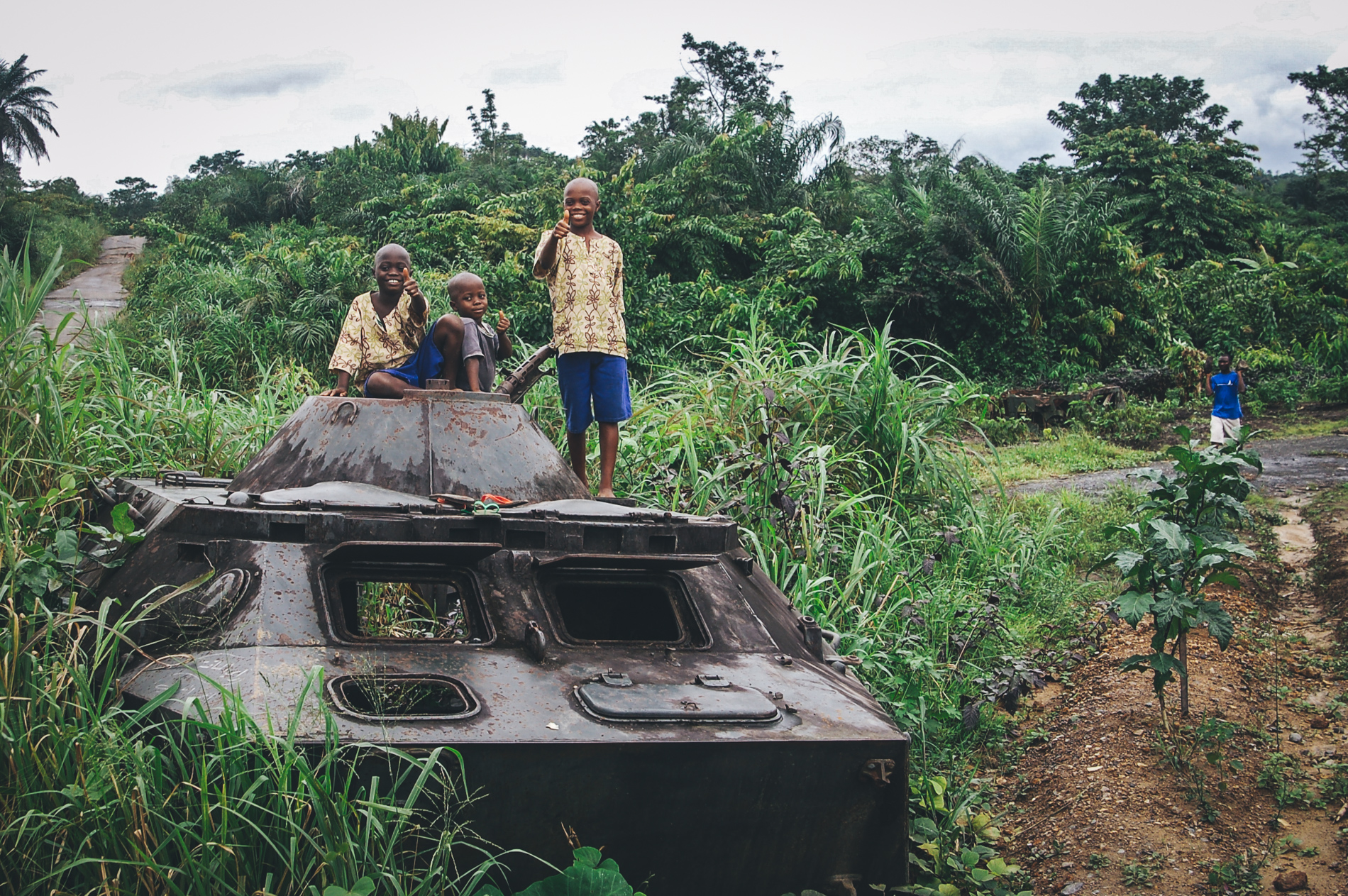 african kids playing on old tank
