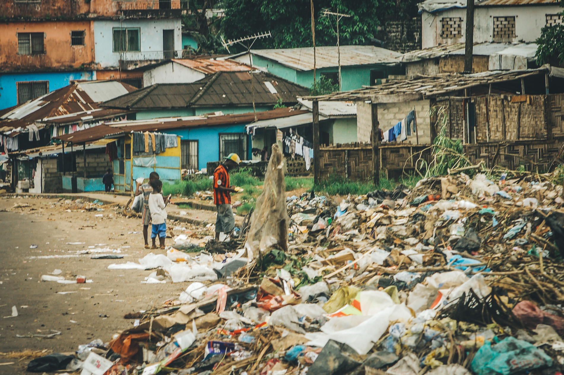 Children beside village trash dump