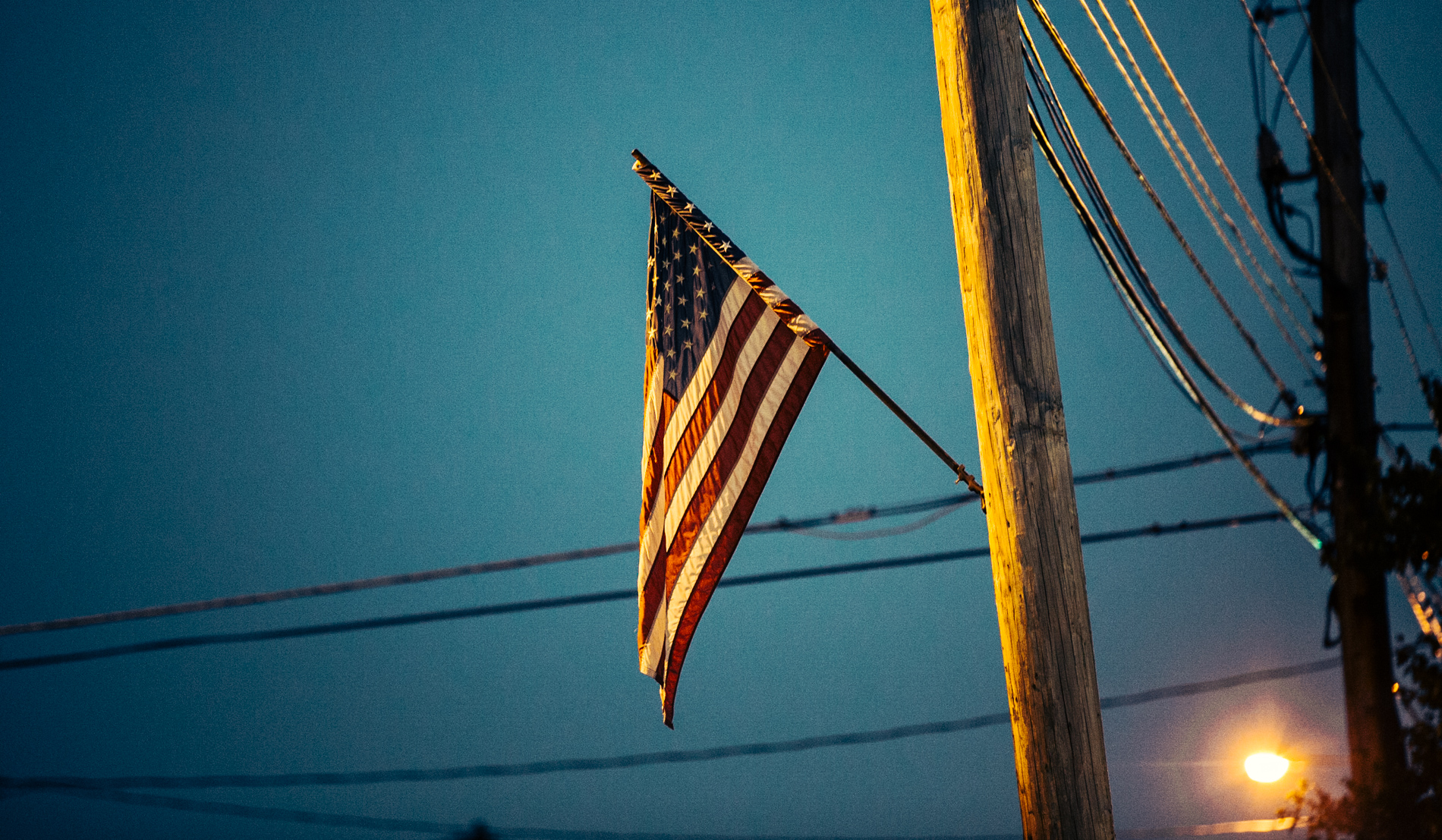 american flag on telephone pole