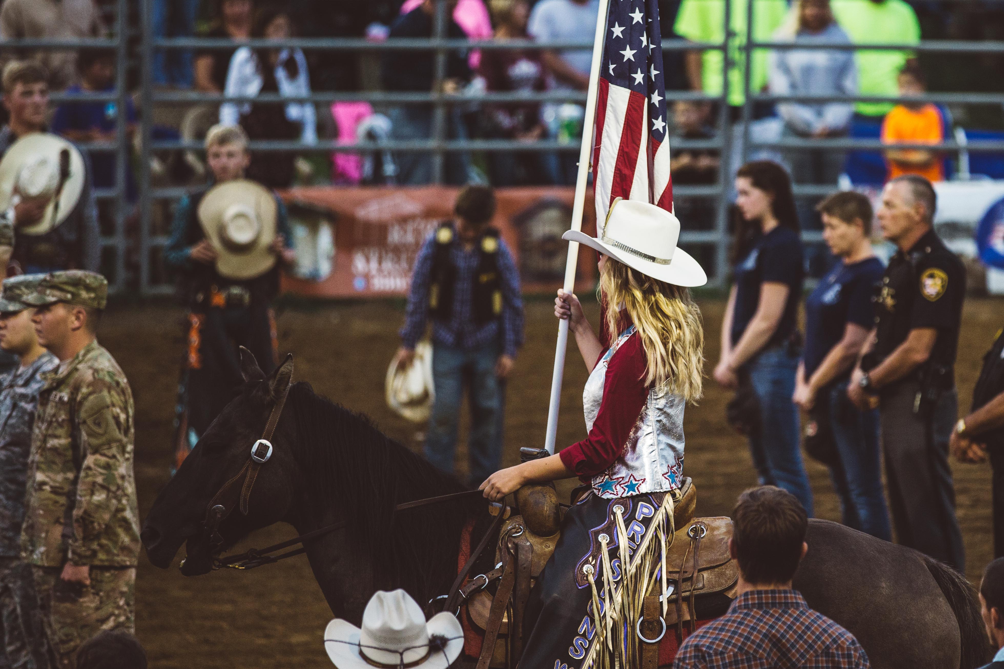 Woman on horse with flag