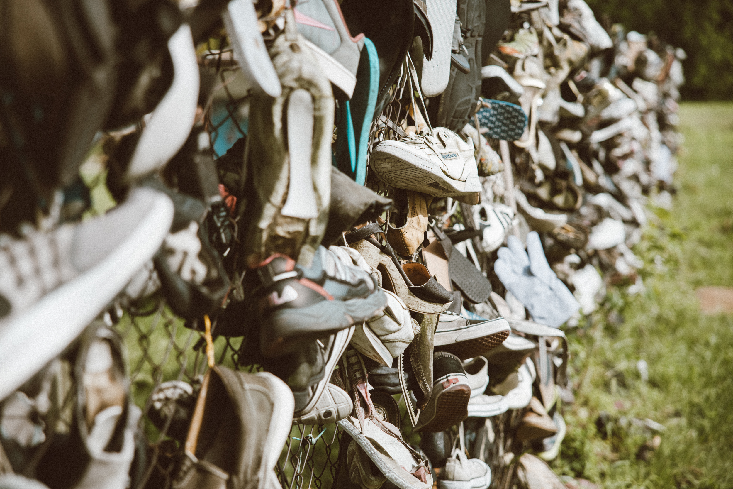 Shoes on fence
