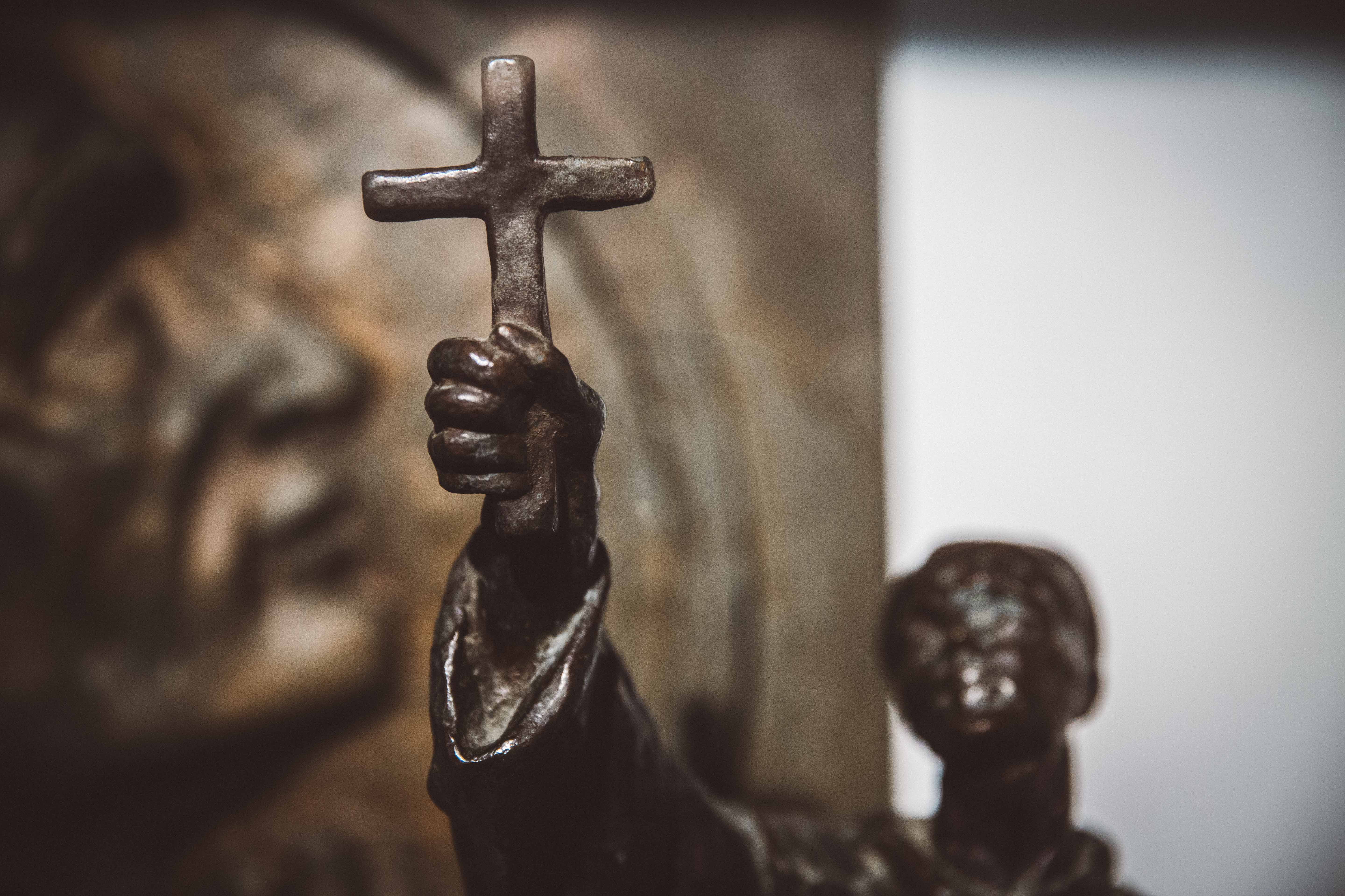 Statue holding cross