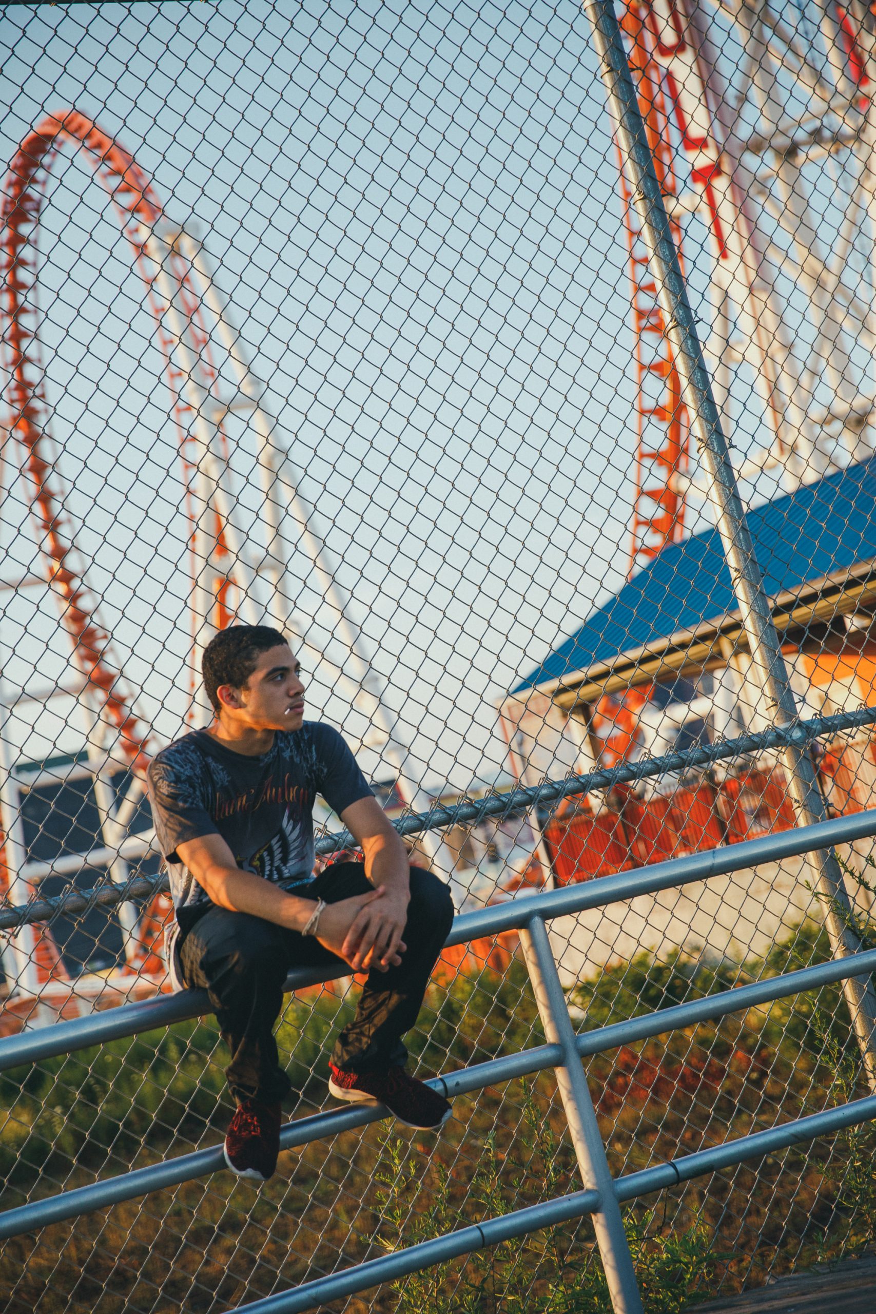 Man sitting on railing
