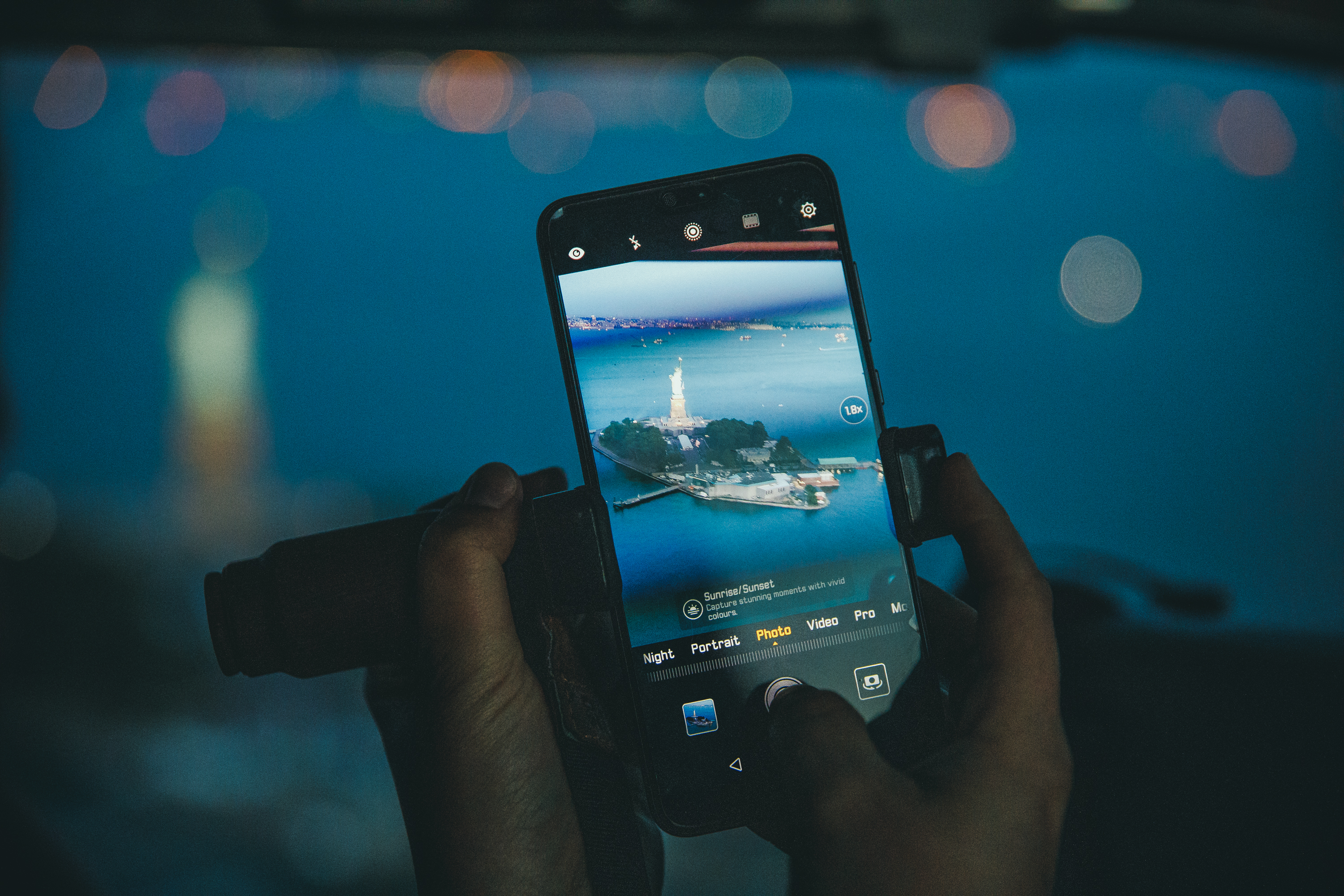 Phone capturing Statue of Liberty