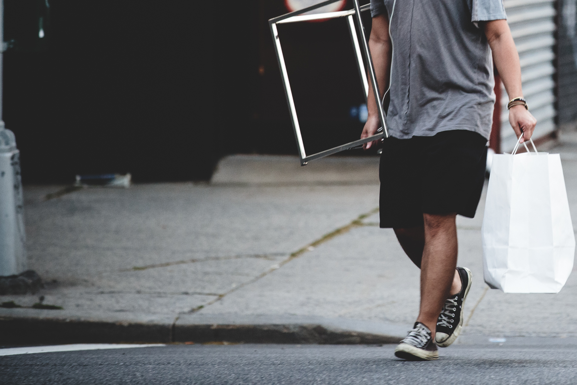 man walking carrying items