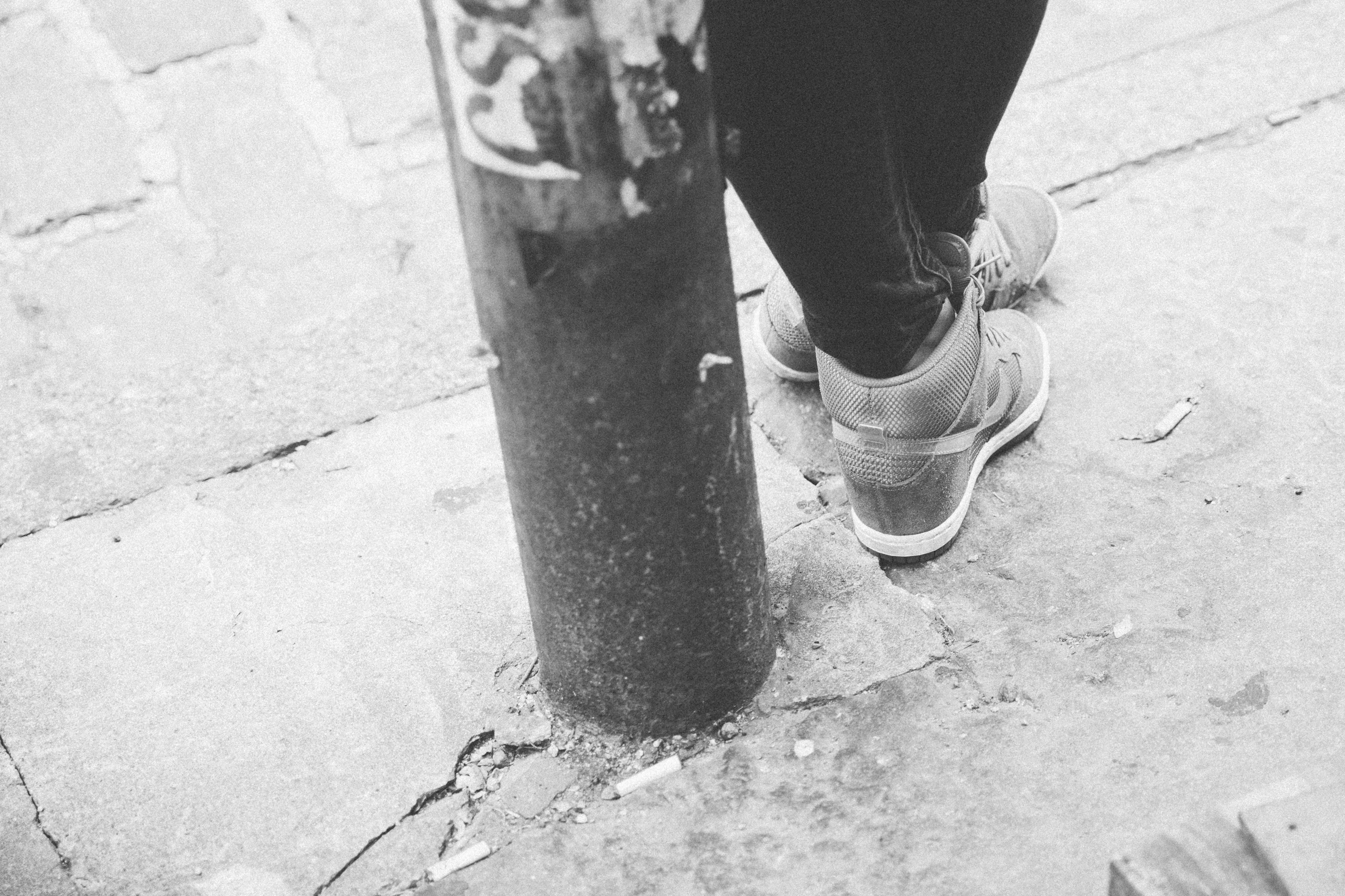 Leaning on pole