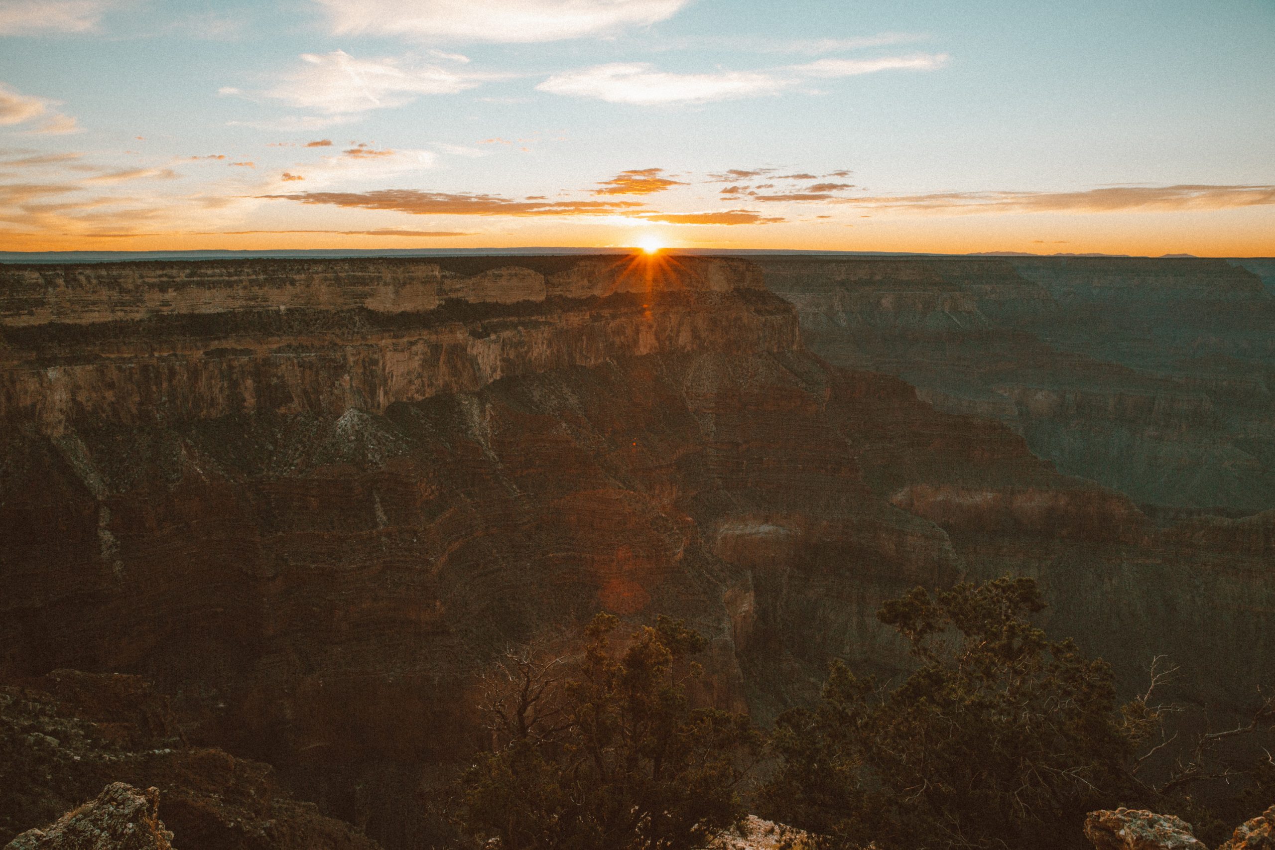 Sun behind mountains