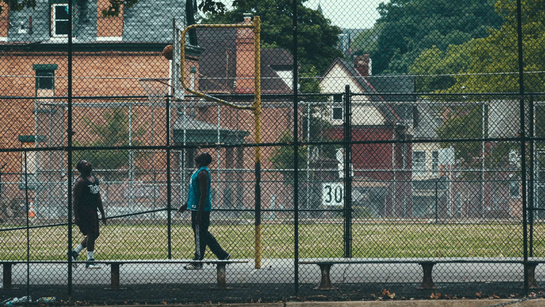 two guys playing basketball