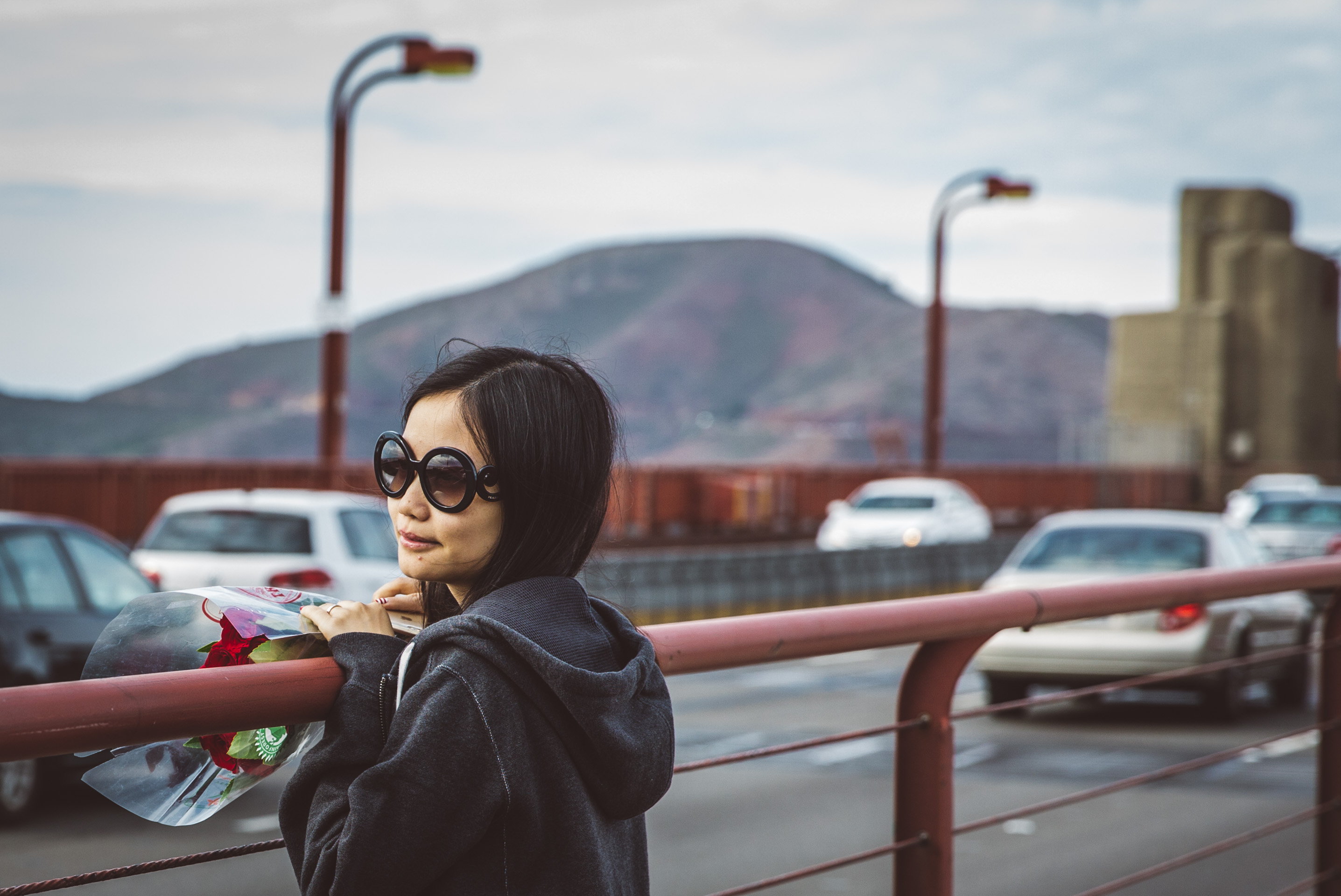 girl standing on bridge