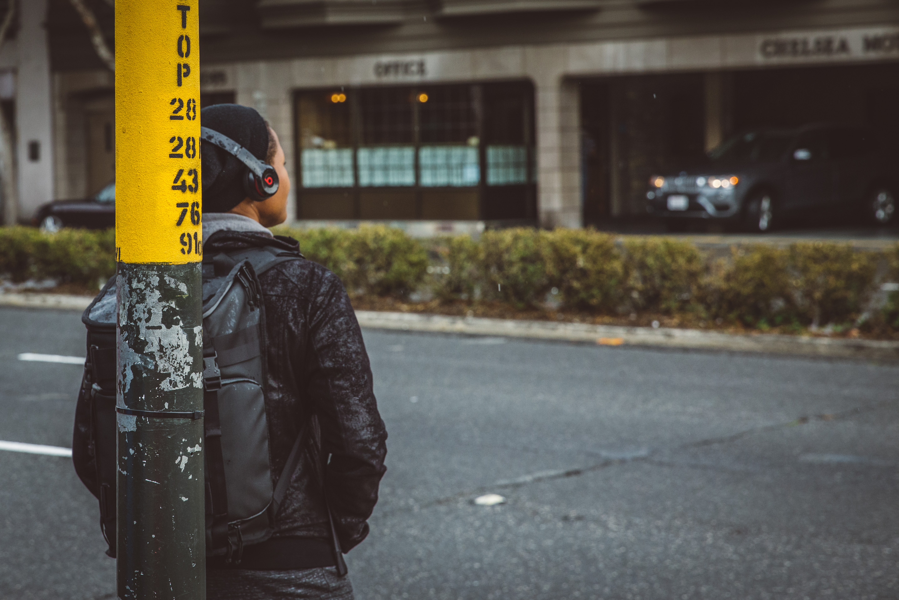man standing on the street corner