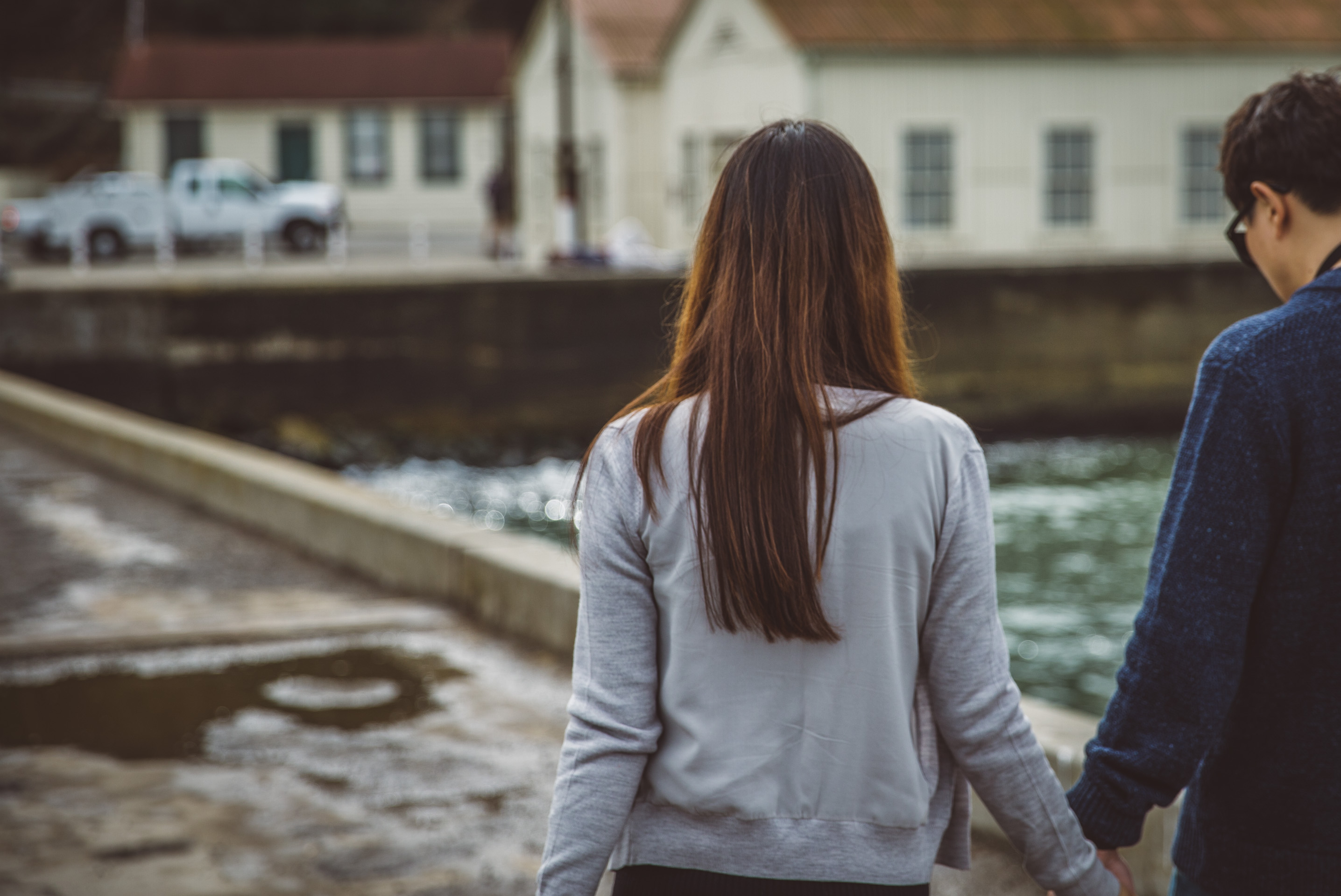 guy and girl walking holding hands