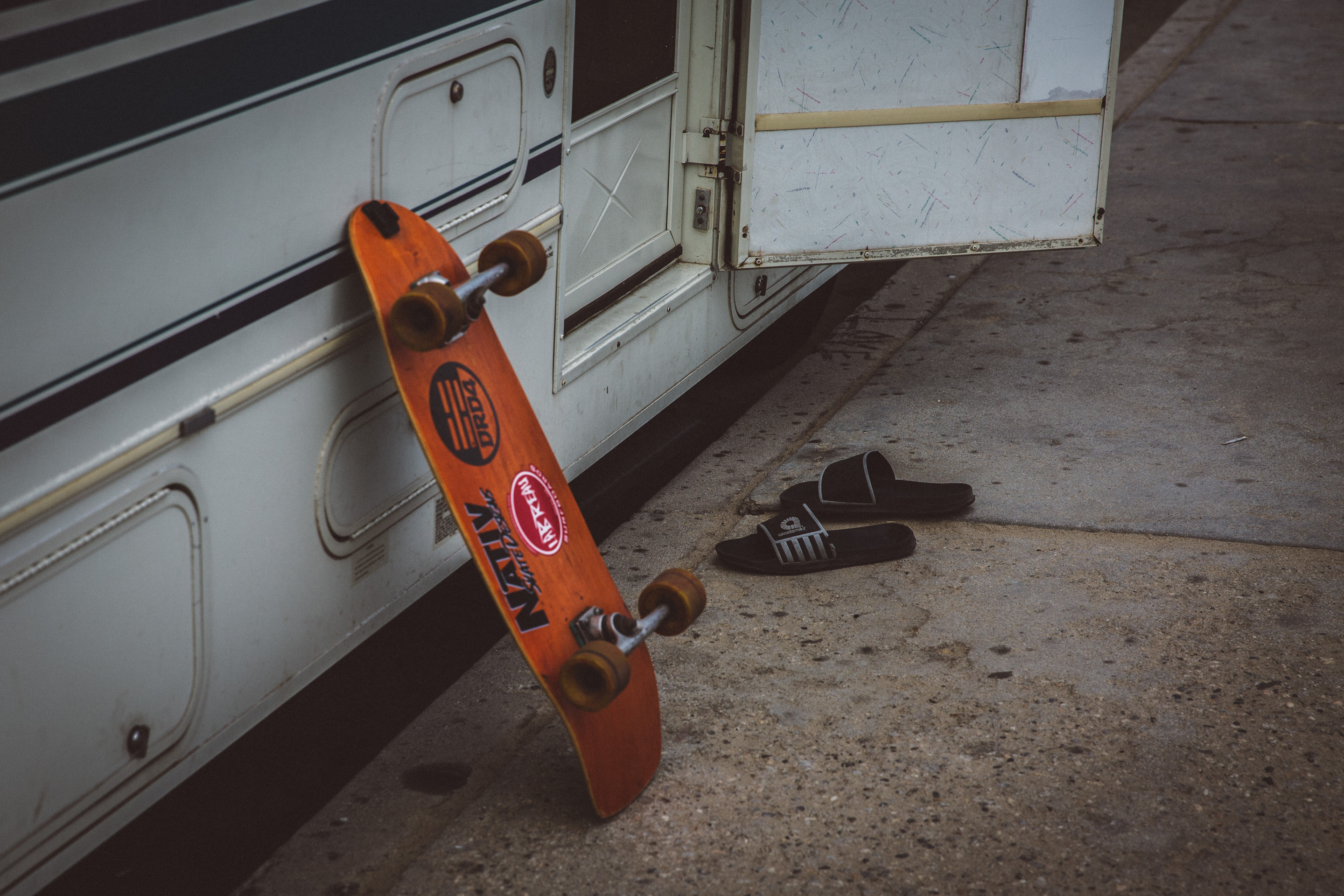 skateboard leaning up against rv