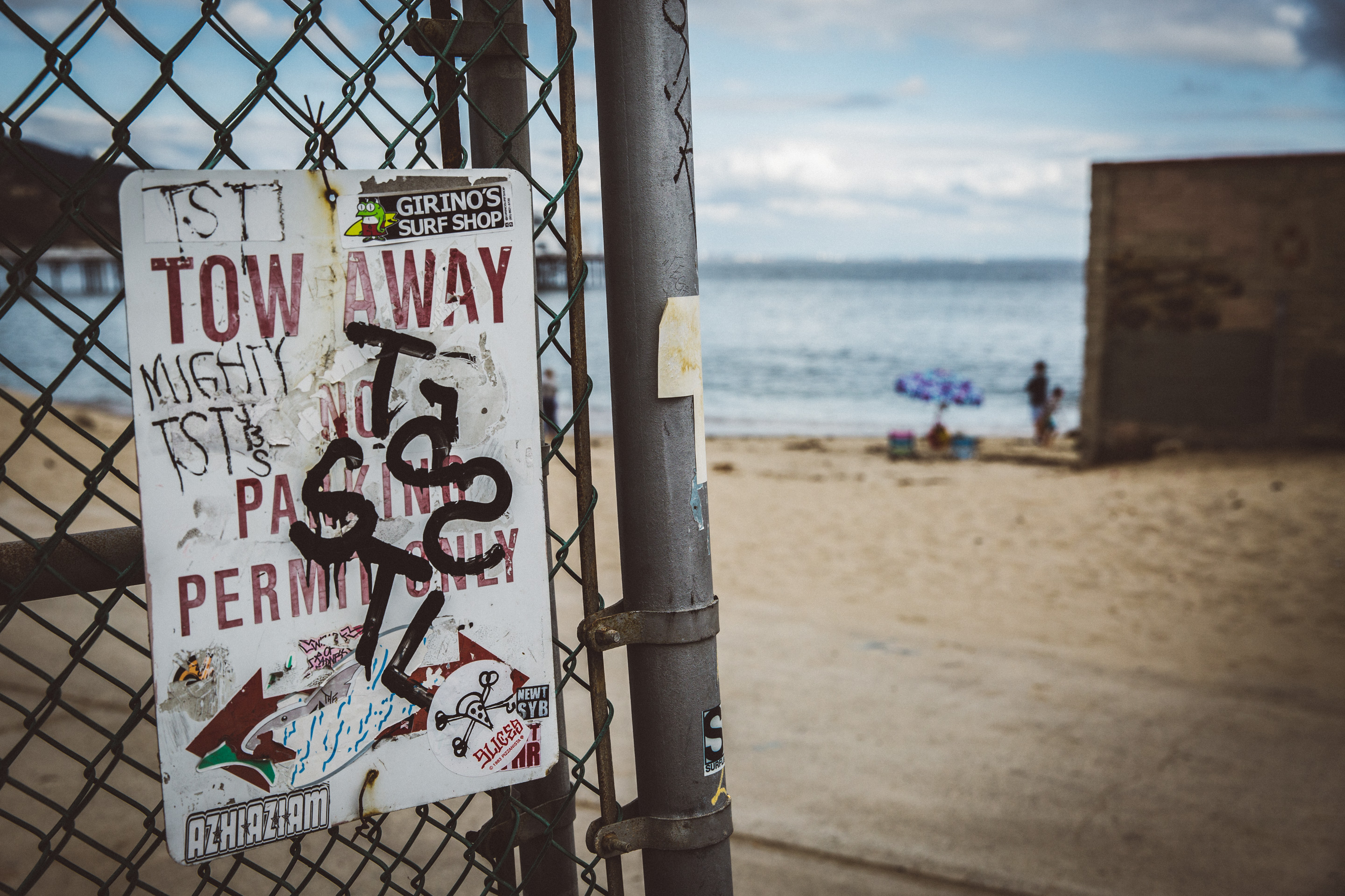 Graffiti on the fence by the beach