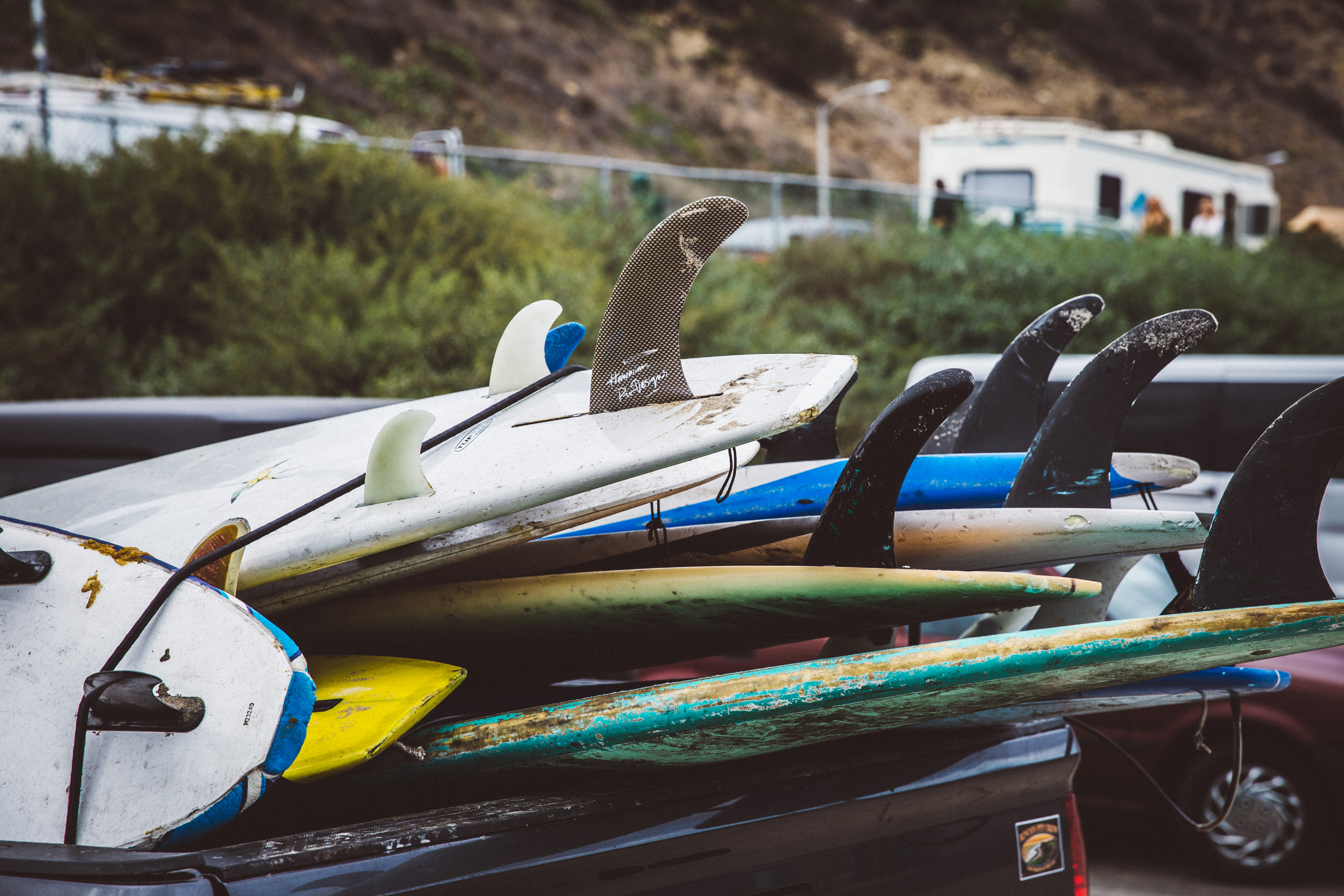surf boards in the back of a truck