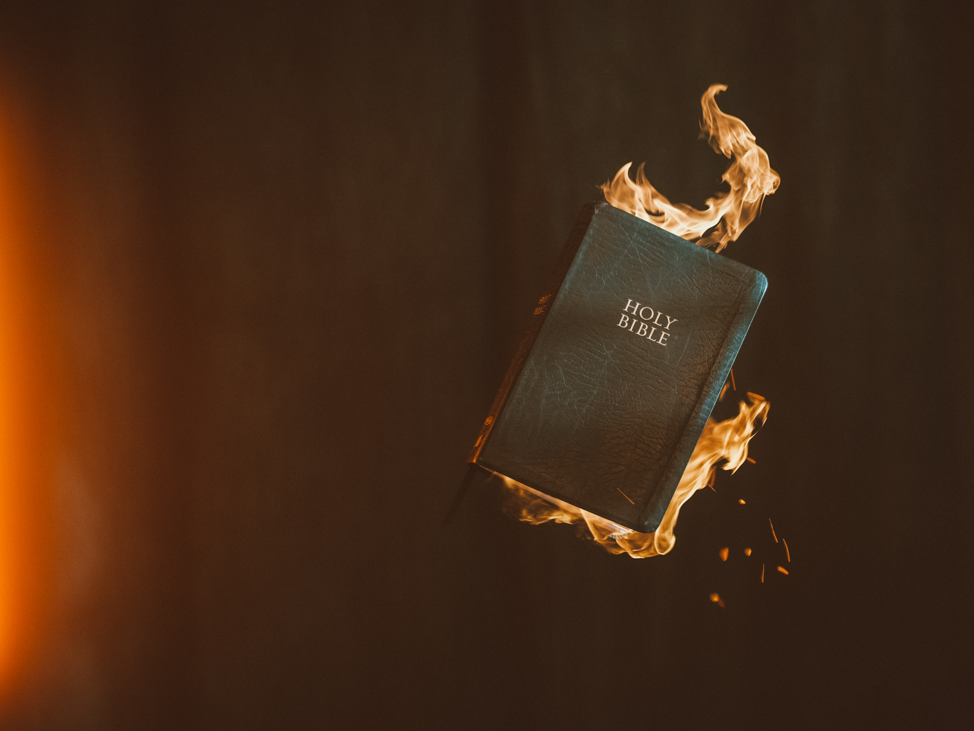 Closed bible on fire